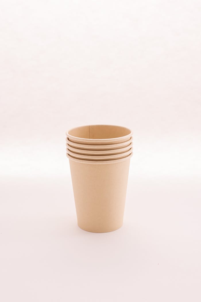 A minimalist photo of stacked brown paper cups showcasing sustainability.